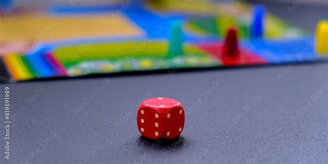 Dice for board games on black background. Board game with multi-colored ...