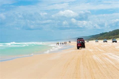 4wd Vehicles at Rainbow Beach with Coloured Sand Dunes, QLD, Australia ...