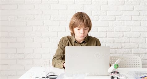 Young boy working or studying on the laptop at home 2800943 Stock Photo at Vecteezy