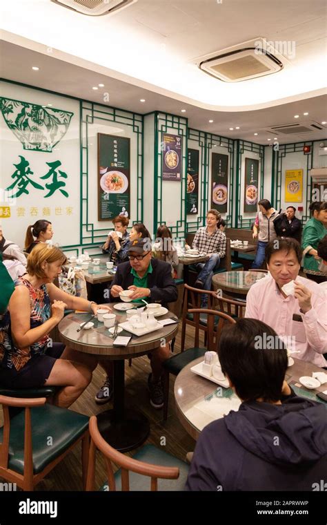 Hong Kong restaurant - people eating and drinking inside a traditional ...