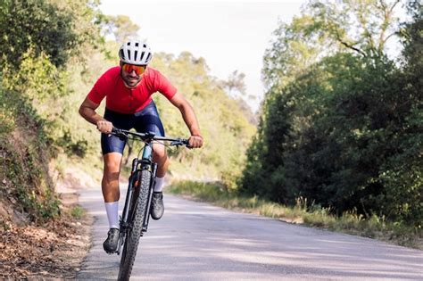 Premium Photo | Cyclist training with mountain bike on a road