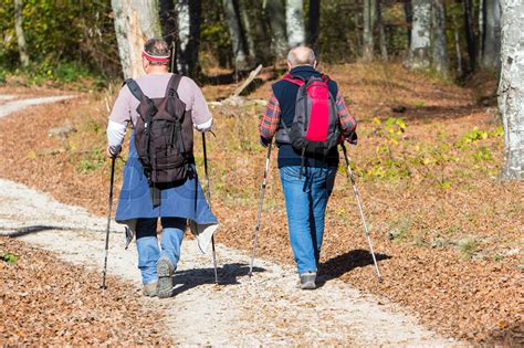 Two older men walking by hiking trail | Stock image | Colourbox