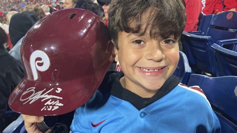 Phillies' Harper flips out on ump, tosses helmet into the stands where it's retrieved by 10-year ...