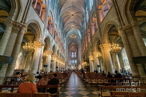 Interior view of the famous Notre-Dame de Paris Photograph by Chon Kit Leong - Fine Art America