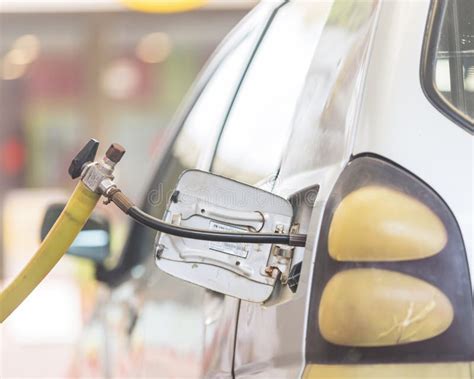 Filling CNG Fuel in the Car at CNG Station Stock Photo - Image of motor ...