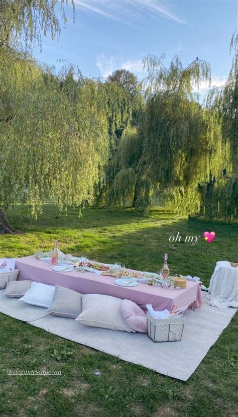 a picnic table set up in the middle of a field