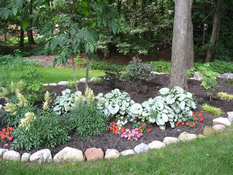 Expert Landscaping Design Tips | Landscaping with rocks, Shade landscaping, Front yard tree ...