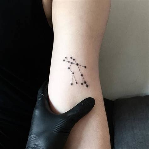 Minimalist style Gemini constellation tattoo on the left inner arm ...