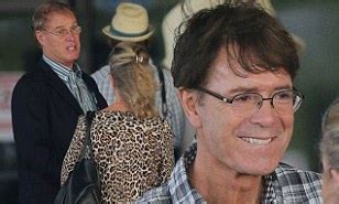 Sir Cliff Richard spotted at Barbados airport with companion John McElynn