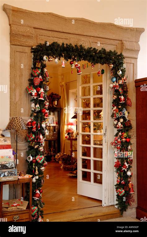 Living-room doorway decorated with Christmas garland Stock Photo ...