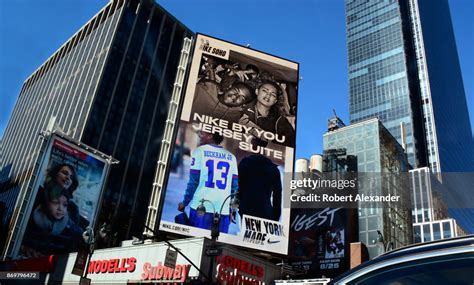 A giant digital billboard in New York City's Times Square advertises ...