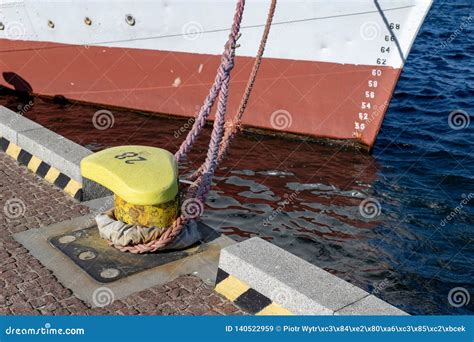 Ship Mooring Rope Moored on the Bollard. Moored Boat in the Port Stock ...