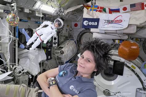 Space station's Italian commander, with lookalike Barbie, tells girls ...