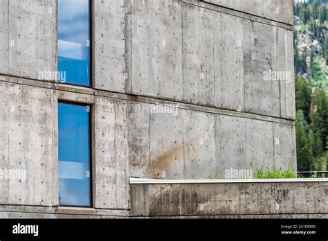 Brutalist architecture with concrete walls and glass windows abstract ...