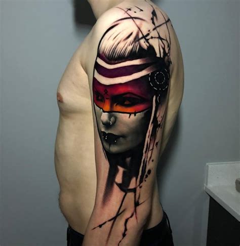 Female warrior portrait tattoo on the upper arm