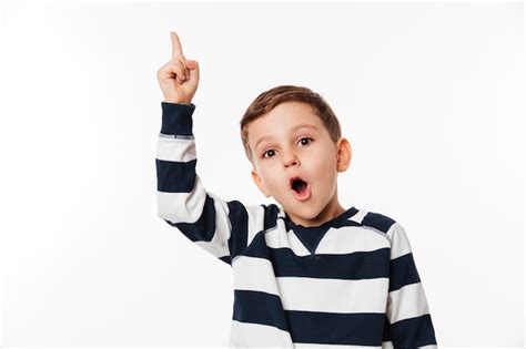 Free Photo | Portrait of an excited smart little kid pointing finger up