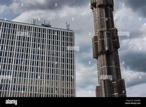 Concrete structure near skyscraper Stock Photo - Alamy