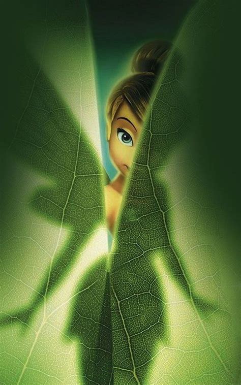 the animated tinkerbell is peeking out from behind a leaf