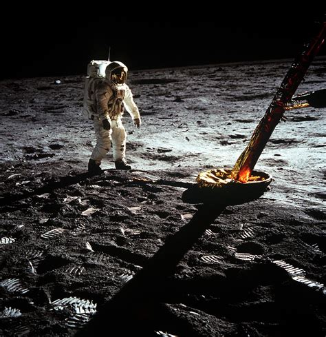 Astronaut Edwin E. Aldrin Jr., lunar module pilot, walks on the surface of the moon near a leg ...