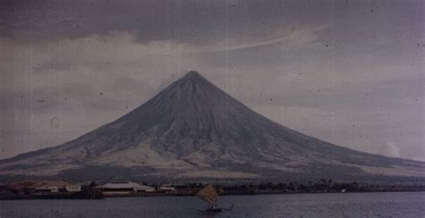 Mayon Volcano, a beautifully symmetrical but dangerous composite volcano on Luzon Island ...