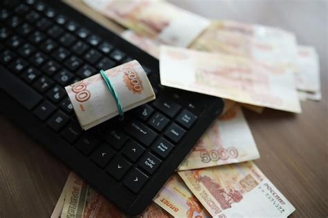 Premium Photo | Stacks of 5000 ruble banknotes on the table next to the ...