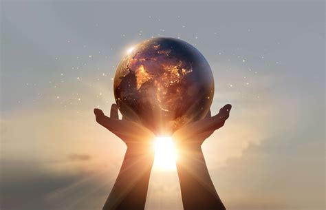 Earth at night was holding in human hands. Earth day. Energy saving ...