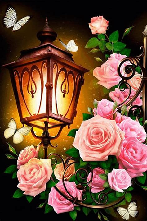 a lamp post with pink roses and butterflies around it on a black background, surrounded by ...