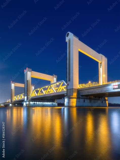 Botlek bridge, Rotterdam, Netherlands. View of the bridge at night. Road for cars and railroad ...