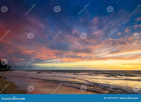 Sunset at the beach stock image. Image of rocks, dusk - 51877419