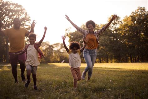 African American Family Having Fun Outdoors Stock Photo - Image of ...