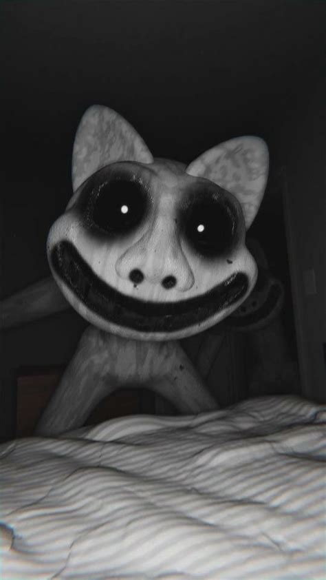 a black and white photo of an animated character on a bed in a dark room