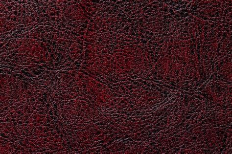 Premium Photo | Dark red leather texture background, closeup