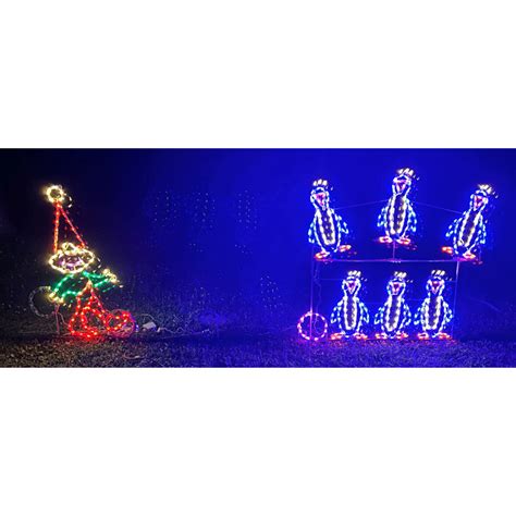 Lori's Lighted D'Lites Animated Elf Bowling with Penguin Pins Christmas Lighted Display | Wayfair