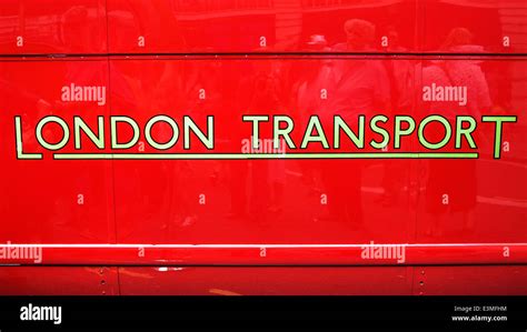 London Transport logo on the side of a red London bus Stock Photo - Alamy