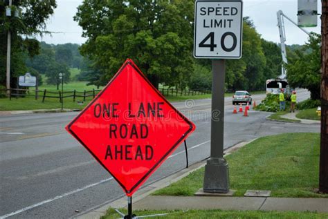 One Lane Road Ahead Construction Sign on the Side of a Five Lane Road Editorial Image - Image of ...