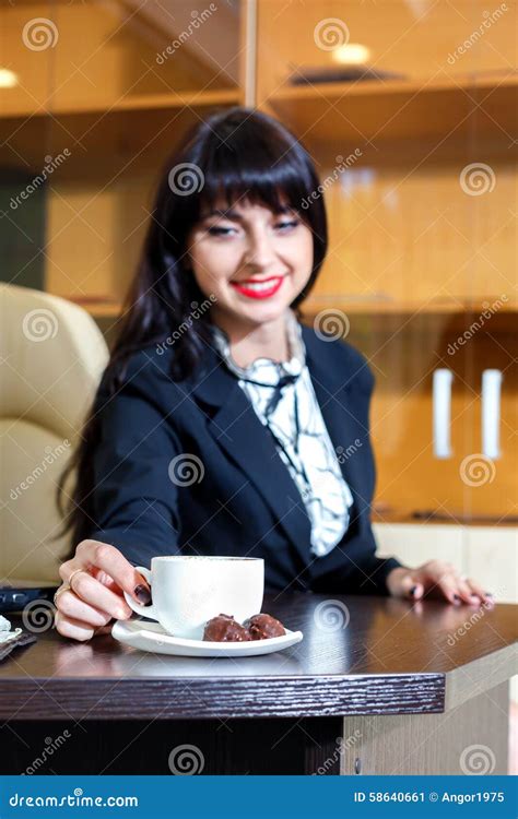 Attractive Girl Takes a Cup of Coffee at a Table Stock Image - Image of city, drinking: 58640661
