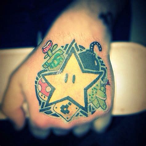 Mario bros theme hand tattoo | Hand tattoos, Tattoos, Triangle tattoo