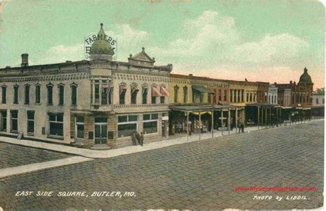 Butler, Missouri vintage postcard of the East Side of the Bates County Courthouse square. The ...