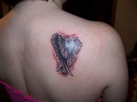 Folded Wings tattoo