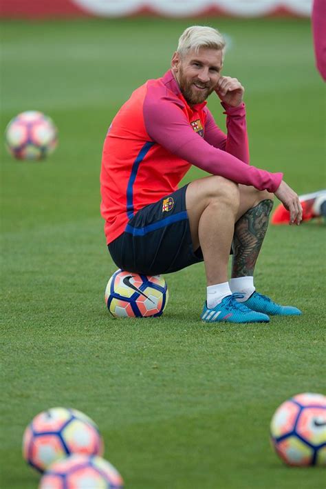 Barcelona's Argentinian forward Lionel Messi sits on a ball during a... | Messi fotos, Barcelona ...