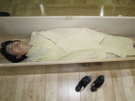 South Korean workers shut inside coffins to make them ‘appreciate life’ | The Independent | The ...