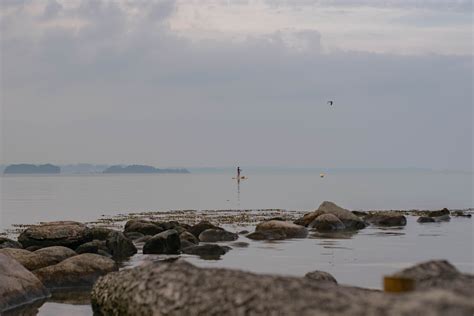 Water at Seashore with Rocks · Free Stock Photo