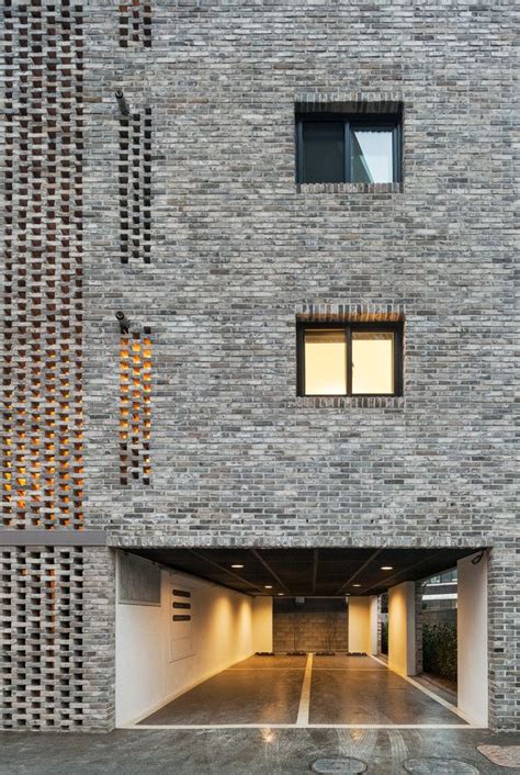 Perforated Brick Facades Make a Home More Stylish and Energy Efficient