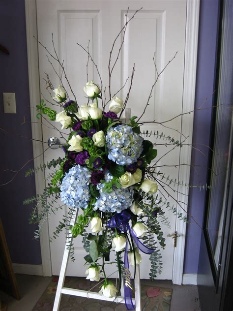 A beautiful sympathy spray by Amazing Petals..love the cool colors | Funeral flower arrangements ...