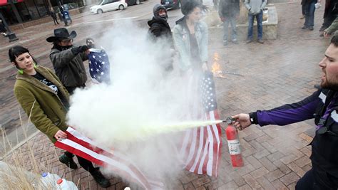 Flag burning protest sets off clash in ped mall