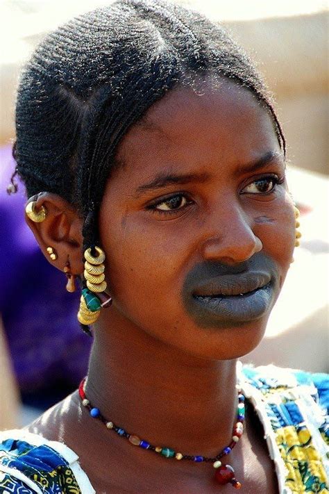 Africa | Portrait of a Fulani woman with her traditionally tattooed mouth and lips. A tradition ...