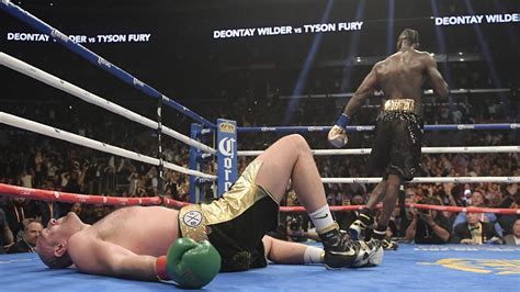 Fury dominates but gets knocked down twice and Wilder keeps title with ...