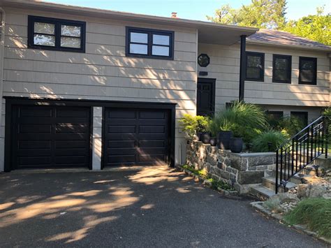 Black garage doors | Black garage doors, Garage doors, Outdoor decor