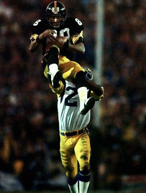 Wide receiver Lynn Swann leaps above a Los Angeles Rams defender to secure a catch during ...