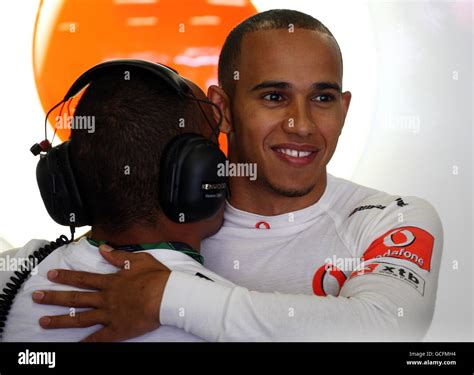 Lewis hamilton hugs his brother nick at the catalunya circuit hi-res ...